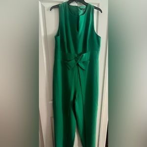 Woman’s green jumpsuit. Never worn. Beautiful sleeveless dressy jumpsuit.